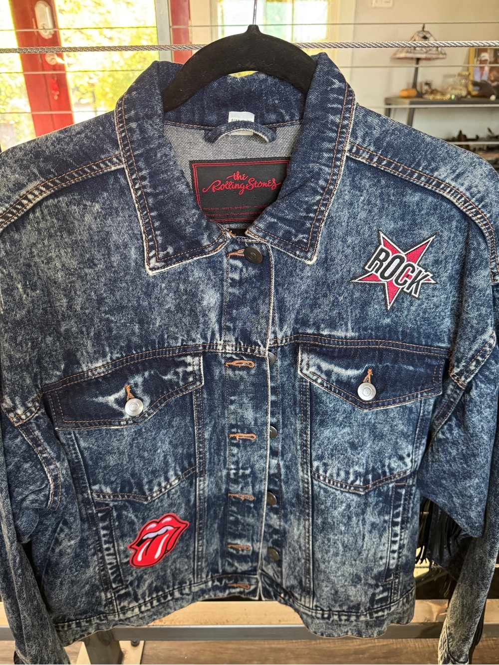 the Rolling Stones Blue Acid-Wash Denim Jacket with Red Patches